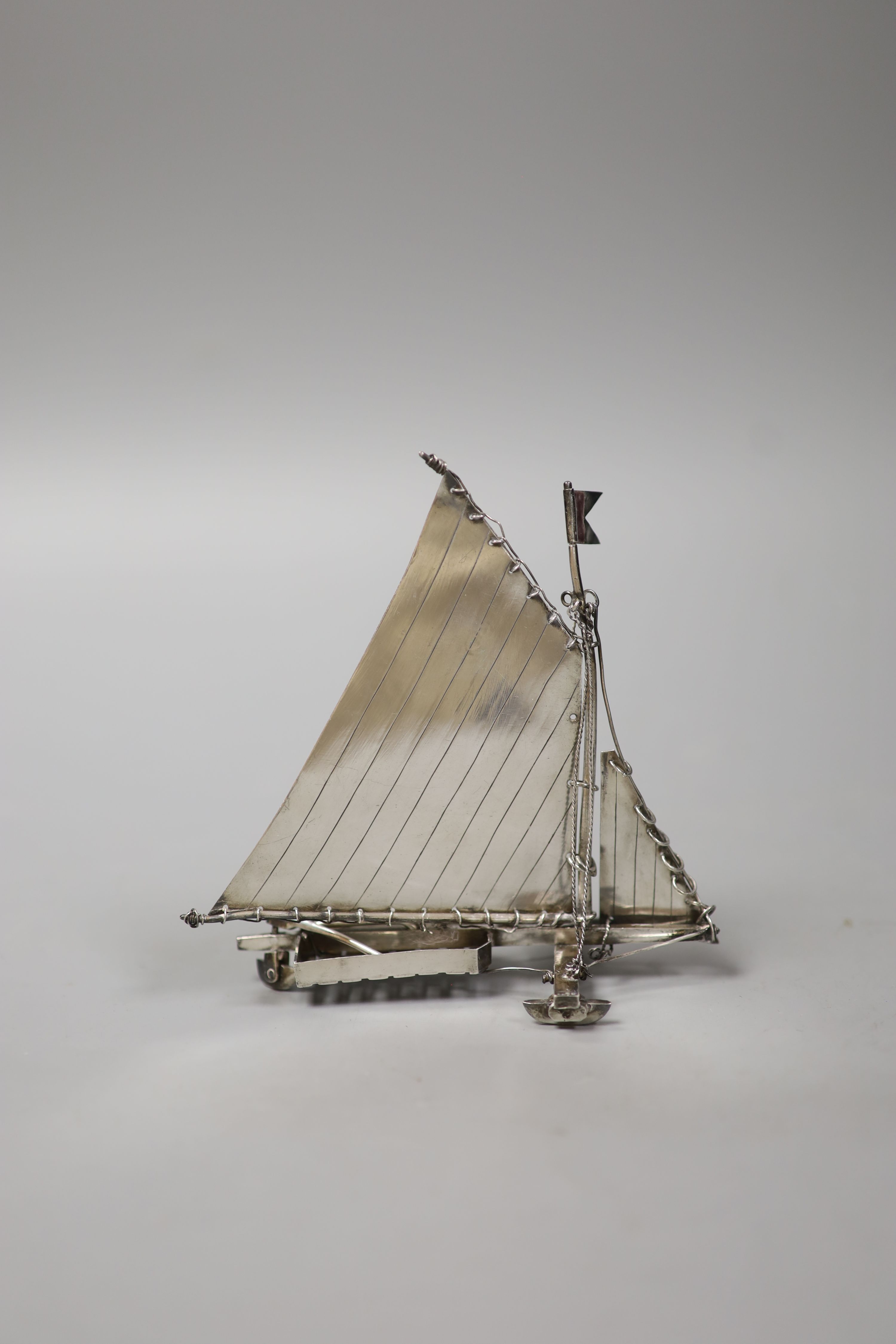 A continental miniature white metal and enamel model of an ice yacht, height 12.5cm, gross 85 grams.